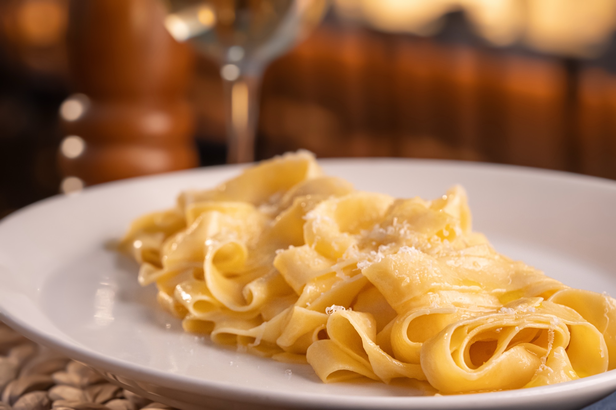 Close-up of pappardelle ribbons dusted with parmigiano